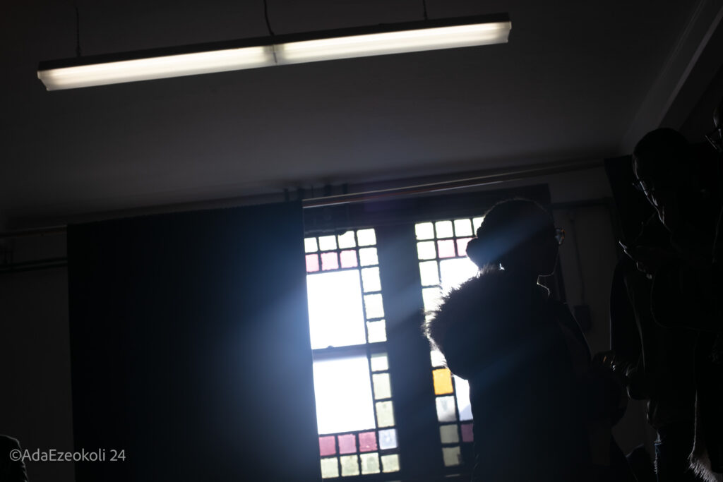 A silhouetted woman and man chatting with each other