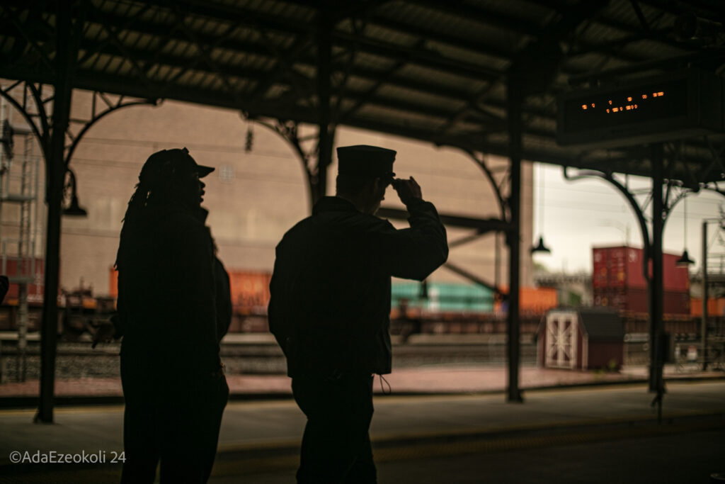 A train conductor and his assistant walk down the train station corridor in Harrisburg