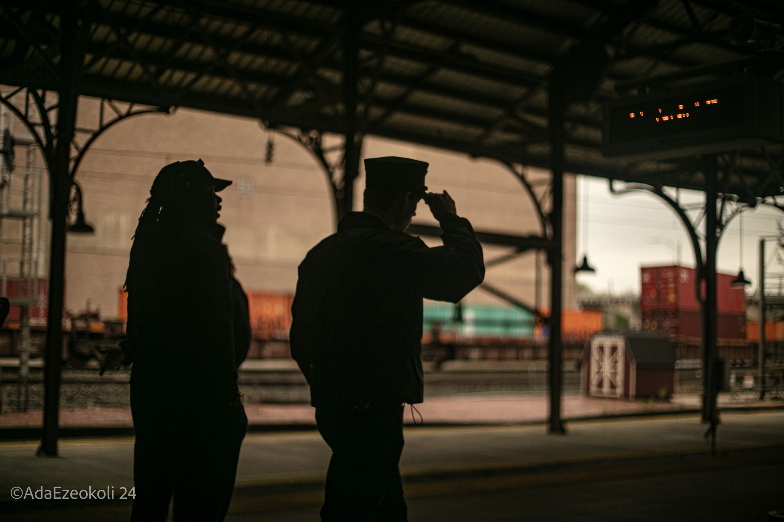 Narrative - Ije A train conductor and his assistant walk down the train station corridor in Harrisburg