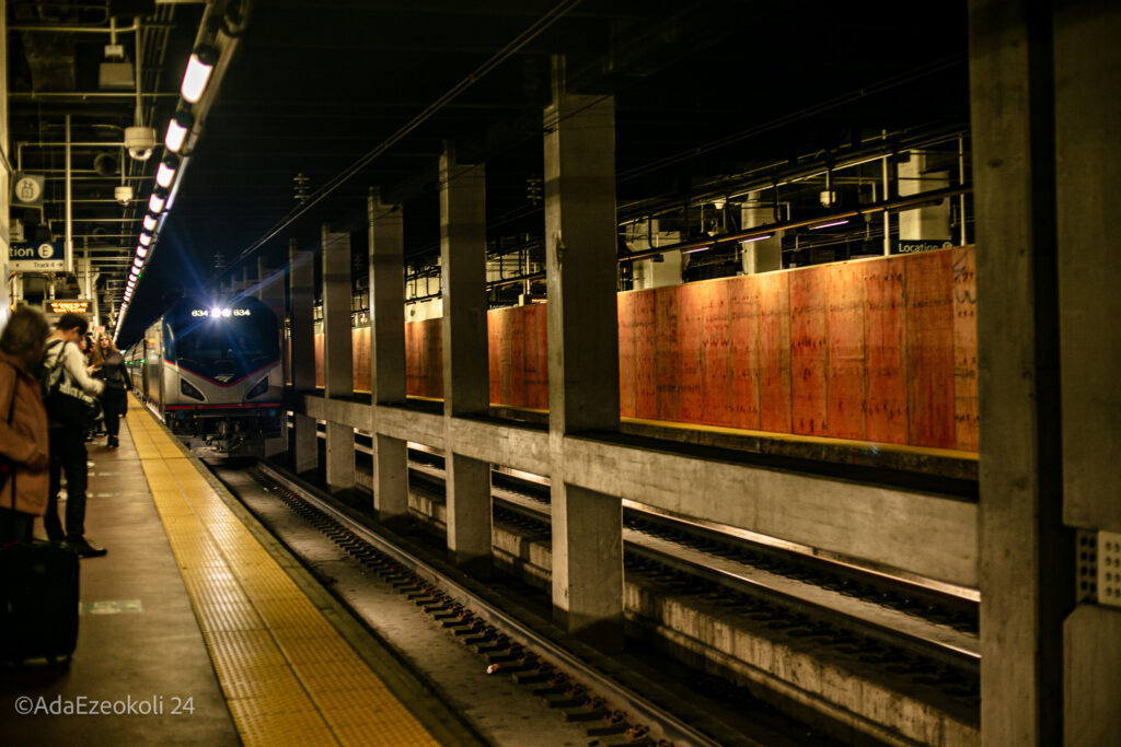 A train approaches on train tracks